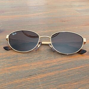 Ray-Ban Women's Gold Frame with Dark Black Lenses Oval Sunglasses